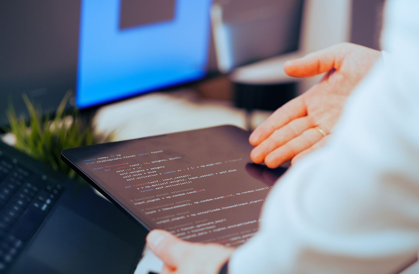 An engineer reviewing records on a tablet